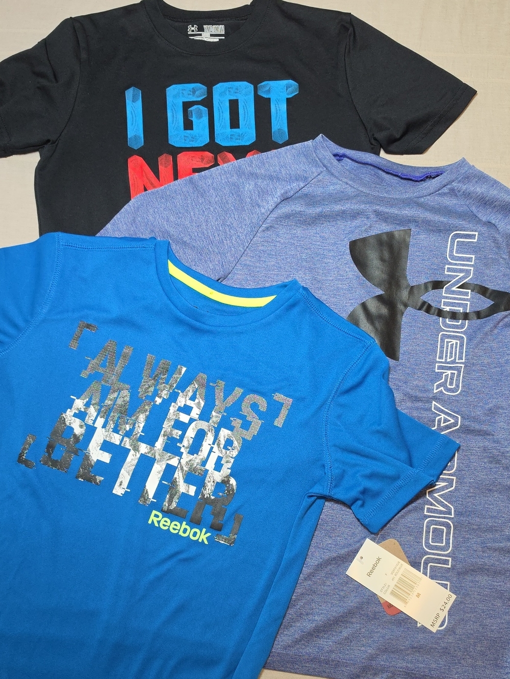 Three (3) Performance Tees Under Armour (2) & Reebok (1) Youth Medium/Large